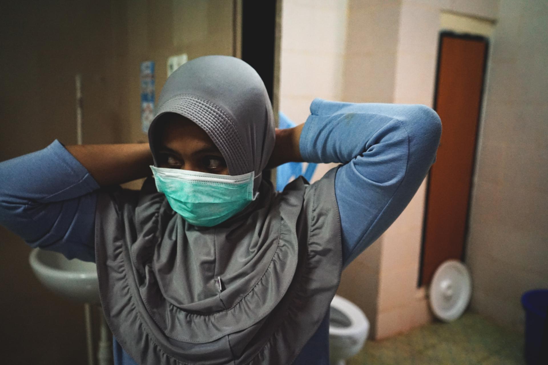 Young woman wearing sanitary mask
