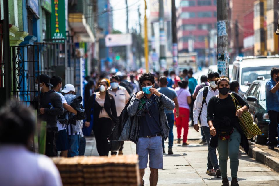 People wearing masks along Calle Luna Pizarro, in Lima, Perù, during Covid 19 pandemic