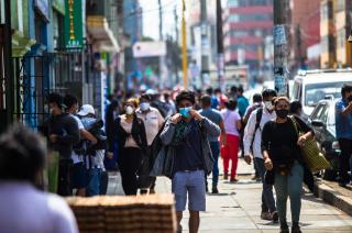 People wearing masks along Calle Luna Pizarro, in Lima, Perù, during Covid 19 pandemic