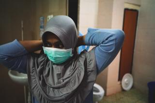 Young woman wearing sanitary mask
