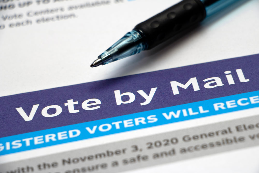 Photo showing envelope with the text, Vote by Mail