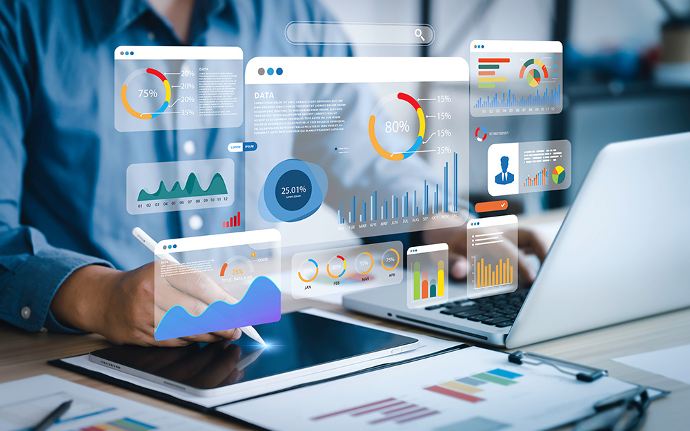 An analyst uses a computer and dashboard for data analysis and Data Management System with KPI and metrics.