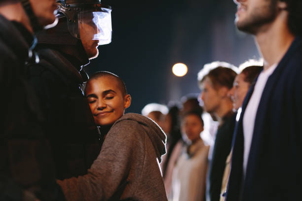 Woman hugging a policeman