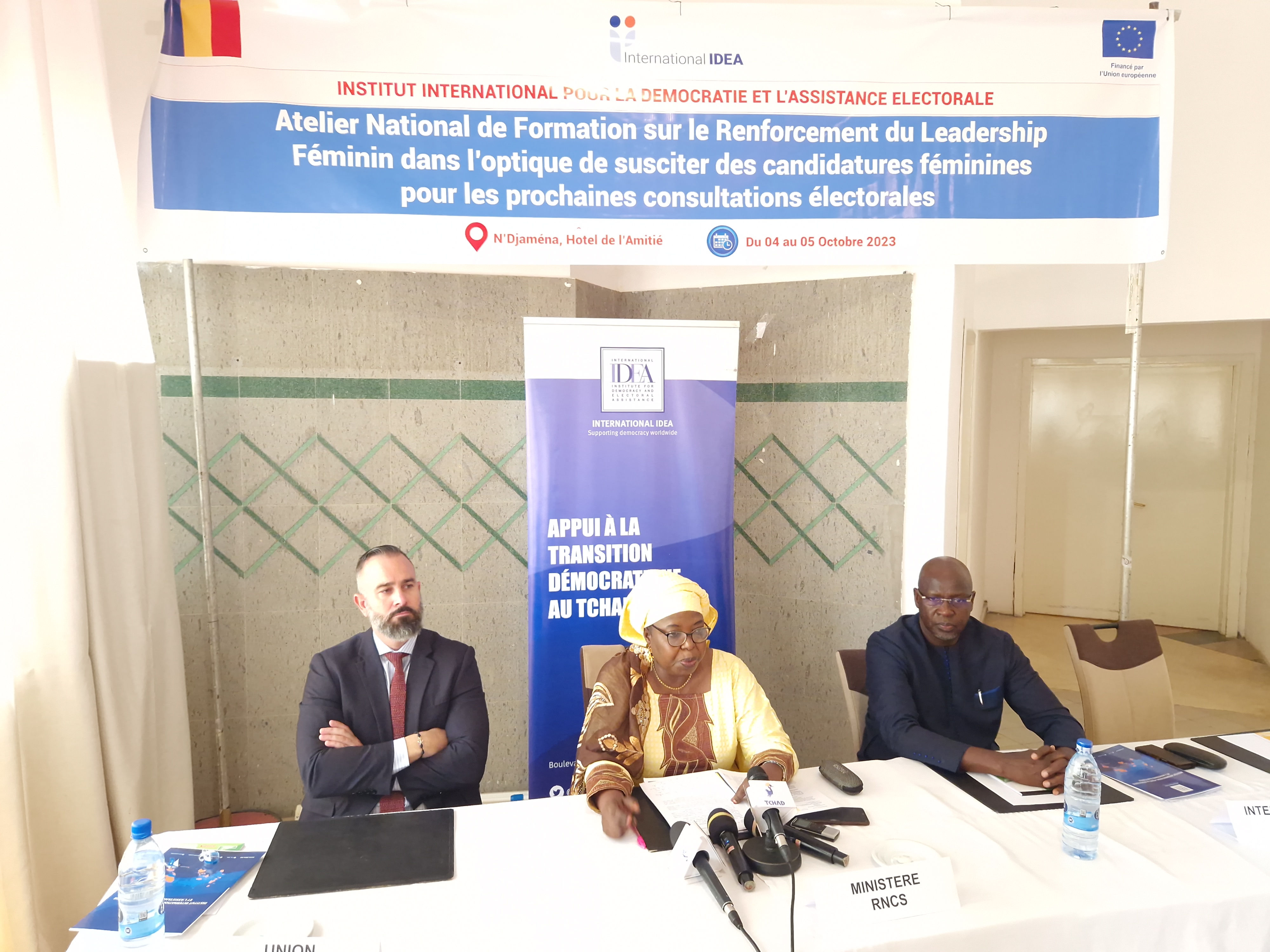 The Secretary General of the Ministry of National Reconciliation and Social Cohesion surrounded by the International IDEA Chad Programme Manager and the Sr Governance and Politics Advisor from the European Union Delegation in Chad.