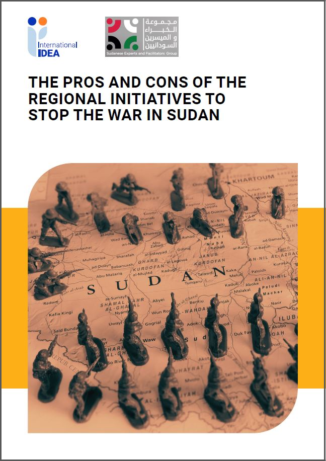 Two lines of toy soldiers facing each other over a map of Sudan