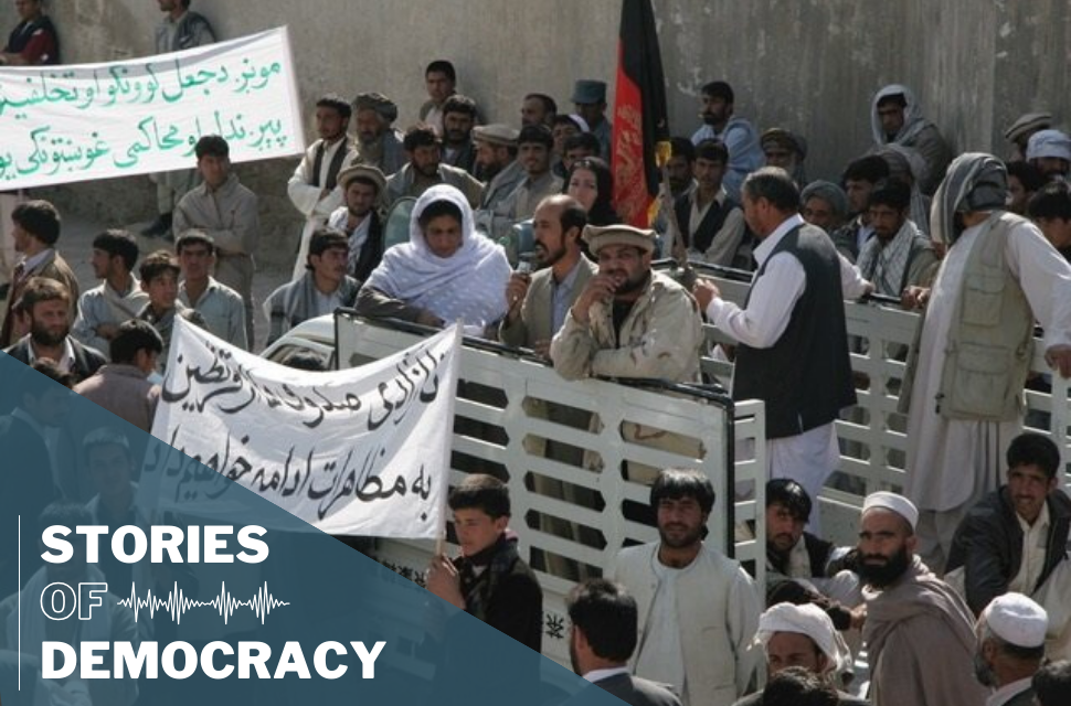 Voters in line outside of a polling station election in Afghanistan.