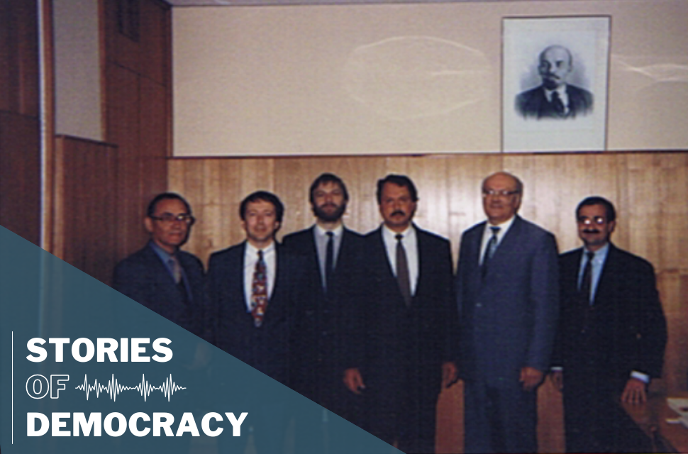 Members of the IFES assessment team – Darrell Slider (second from left), Jeff Fischer (center), and Paul DeGregorio (right) and their two interpreters with Vasily Kazakov, Chairman of the Russian Central Election Commission (CEC) under a portrait of Lenin at the CEC.