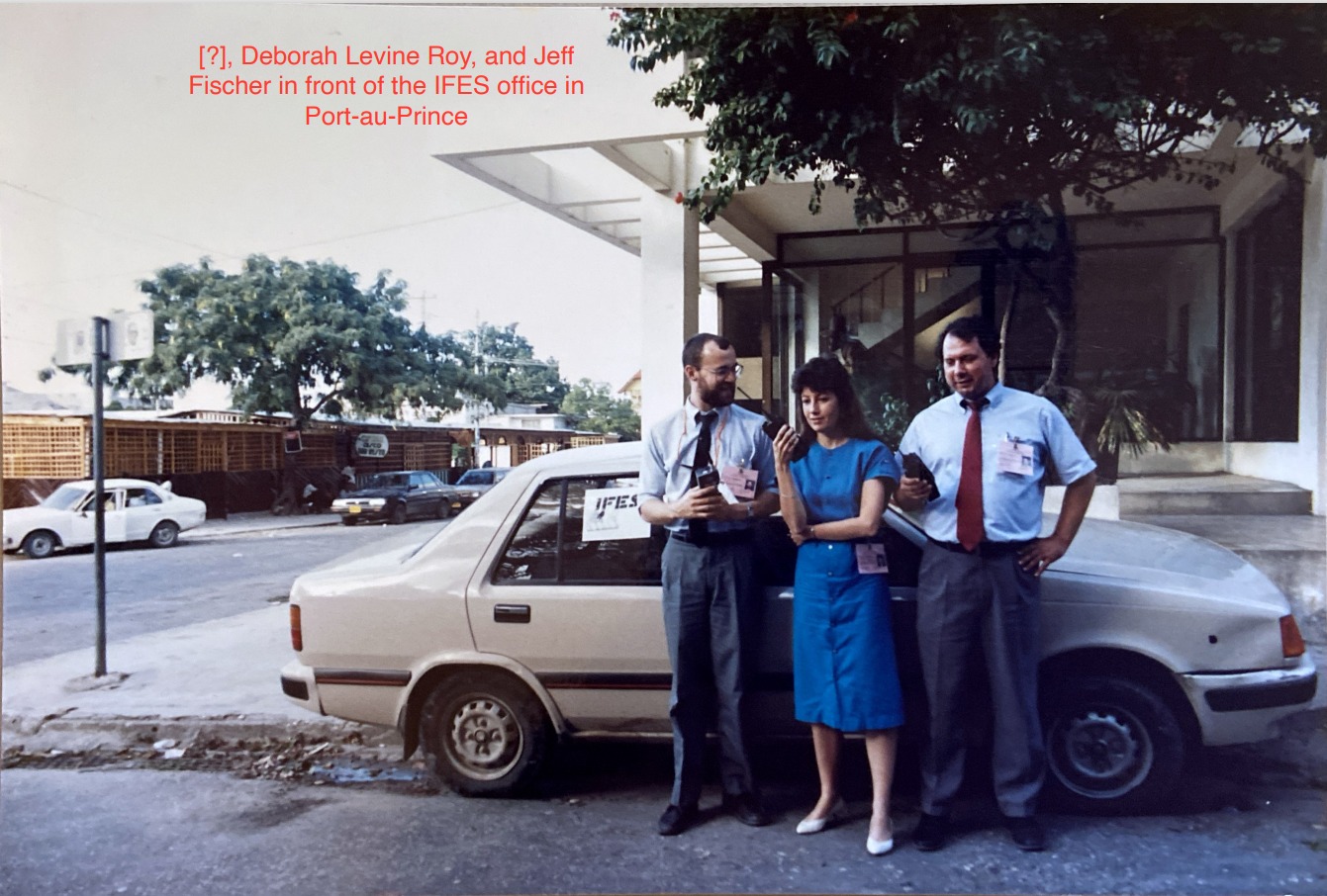 (?), Deborah Levine Roy, and Jeff Fischer in front of the IFES office in Port-au-Prince