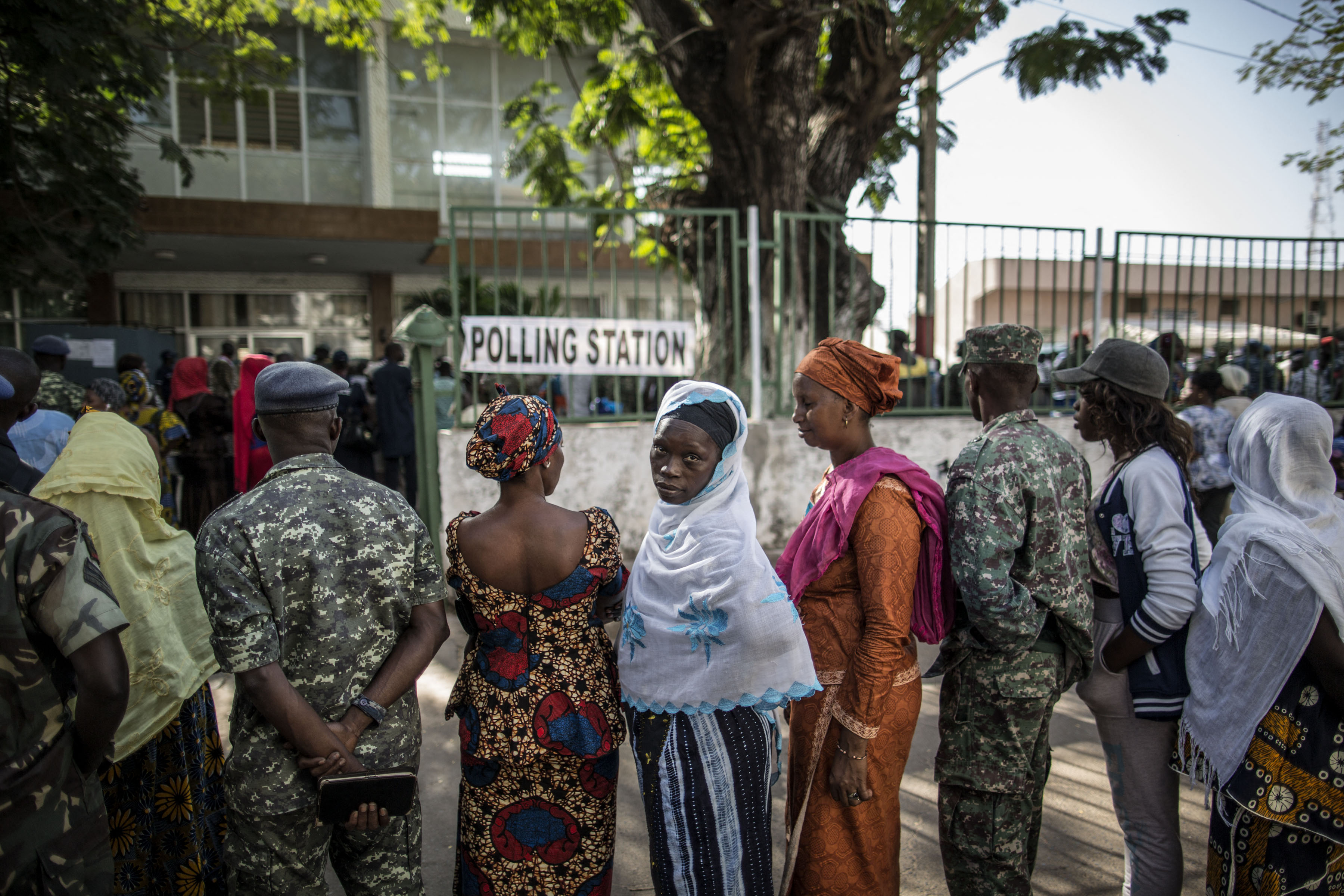 Voters queue at a polling station in Banjul, 1 December 2016, during presidential elections. (Photo by MARCO LONGARI/AFP via Getty Images).