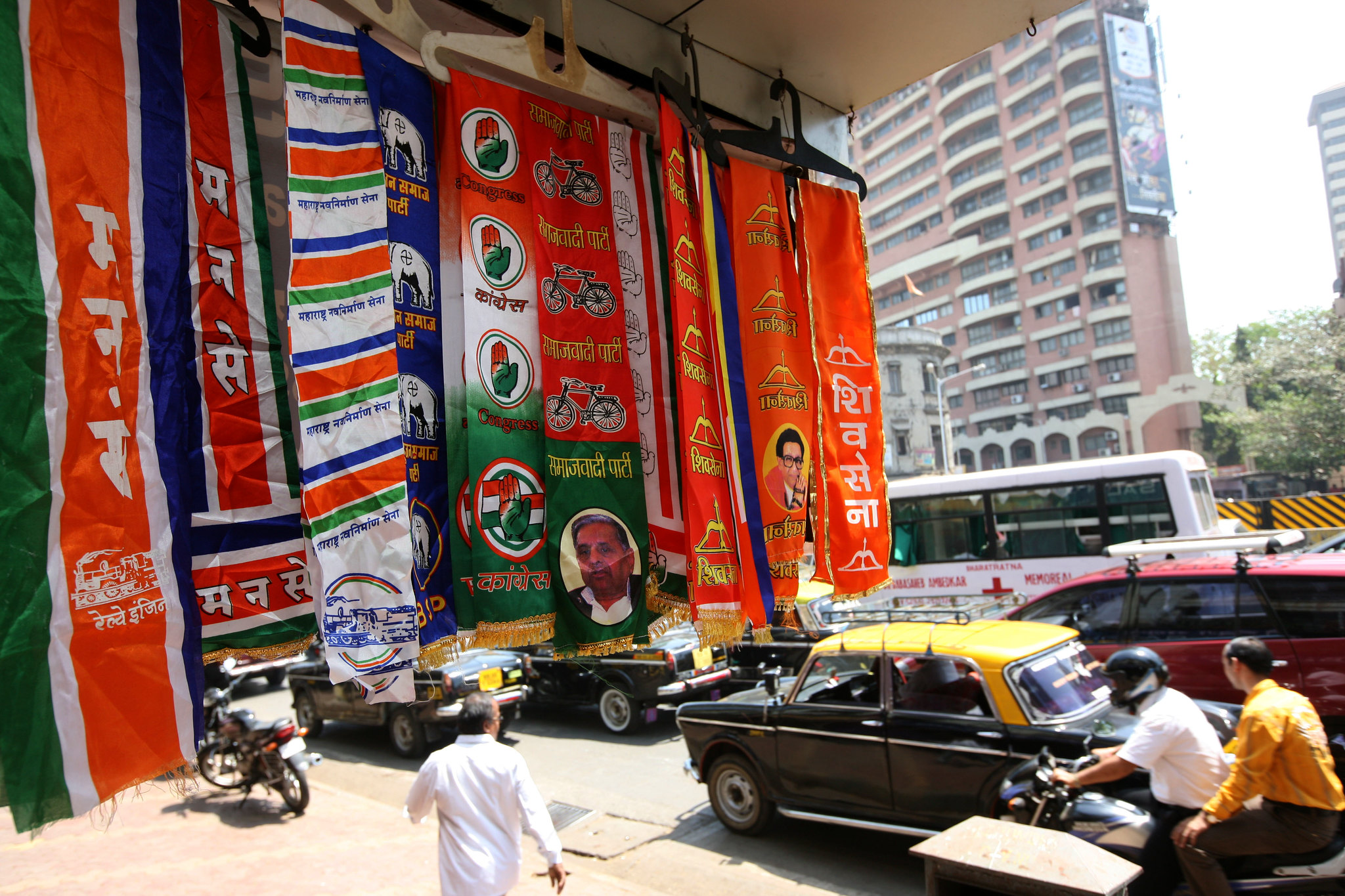 Stoles of different Indian political parties on display in a shop in Mumbai. Stoles are popular among the political leaders and their supporters. Credit: @AlJazeeraEnglish on Flickr   