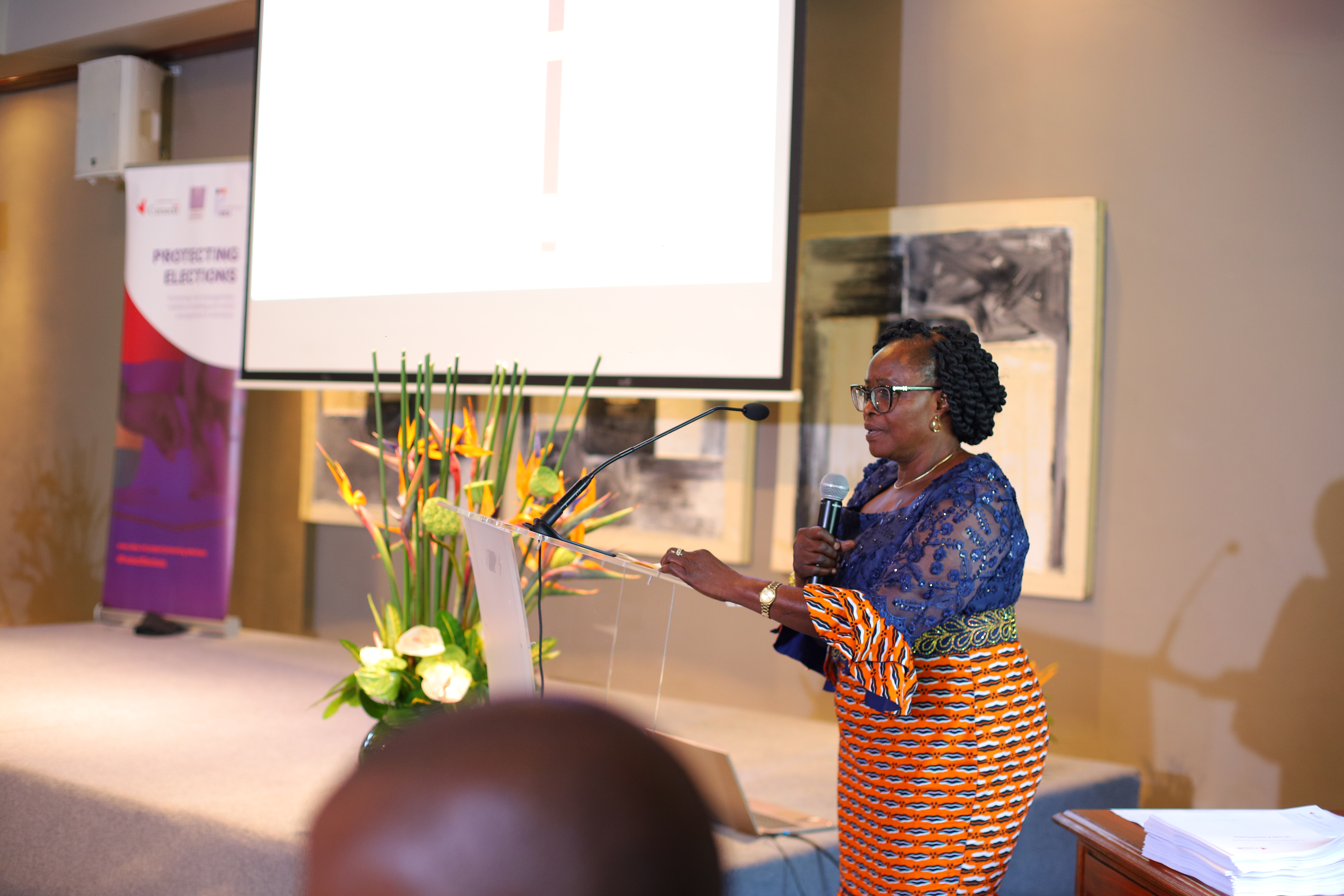 Mrs. Christine Agnélé Mensah-Atoemne, Member and Chair of the Sub-Commission on Finance, Administrative and Legal Affairs, Independent National Electoral Commission of Togo, presenting the case of Togo: legal solutions to address gender-based discrimination and violence in elections. Photo by Lume / International IDEA. 