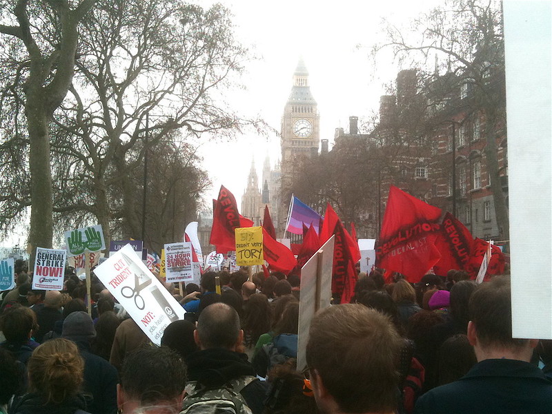 People march in London, May 2011. (<a href="https://flickr.com/photos/chanceprojects/5564044196/" target="_blank">Photo</a> by Neil Cummings / <a href="https://creativecommons.org/licenses/by-sa/2.0/" target="_blank">CC BY-SA 2.0</a>)