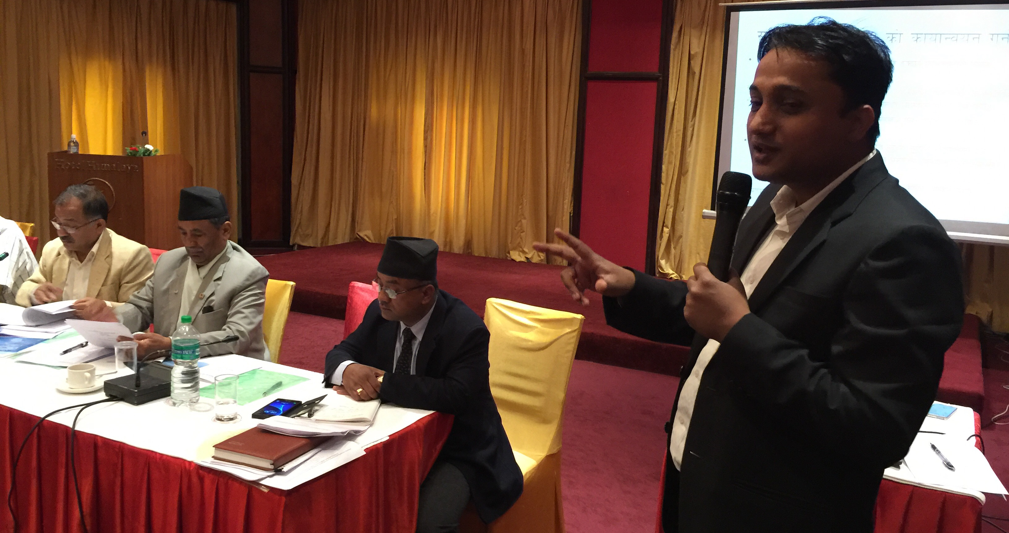 Dipendra Jha introducing draft bill to the members of parliament and civil society actors