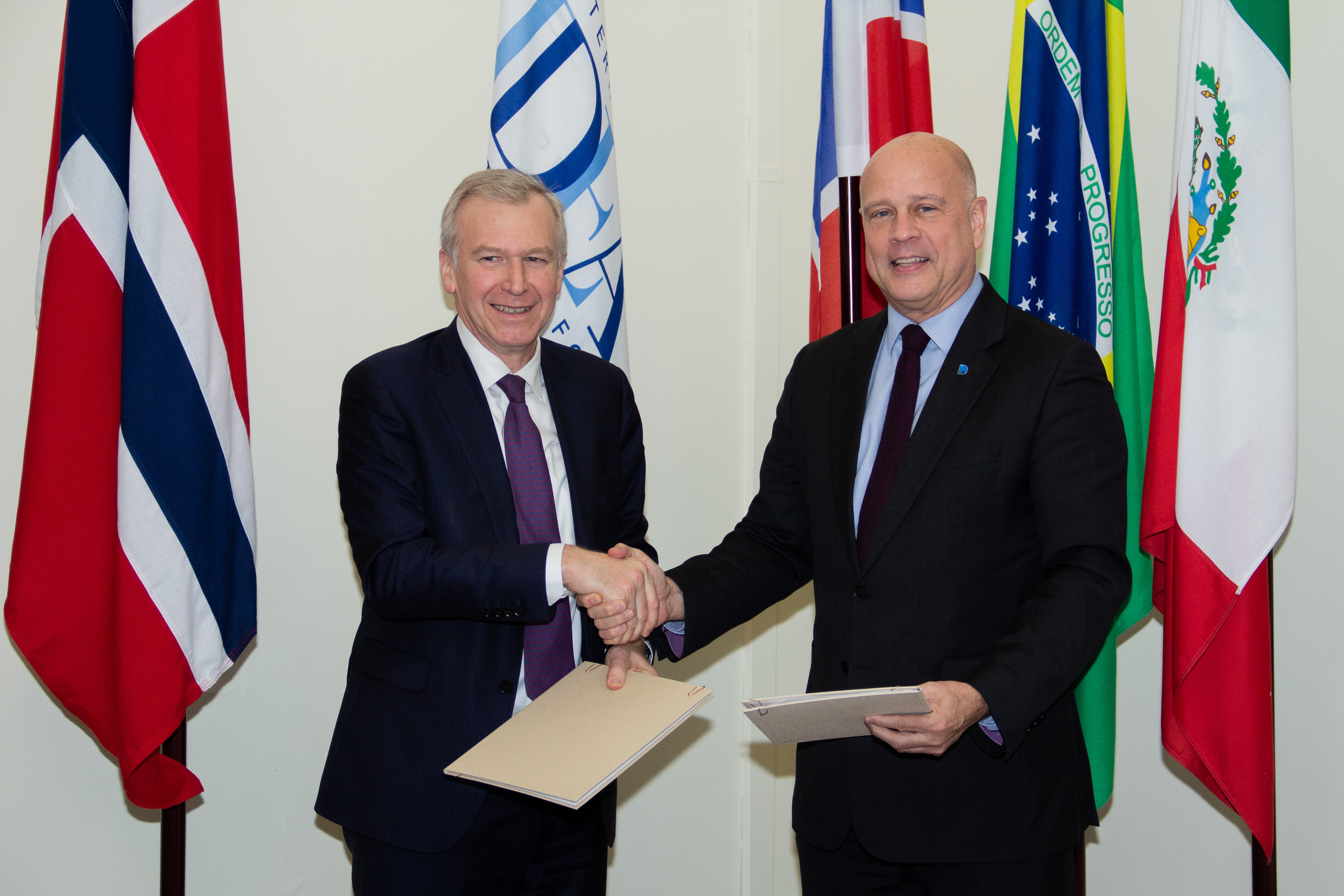 Yves Leterme, Secretary-General of International IDEA and Thomas E. Garrett, Secretary-General of the Community of Democracies  at the signing of the Memorandum of Understanding in International IDEA Headquarters in Stockholm, Sweden. Photo credit: International IDEA/Tomas Spragg-Nilsson.