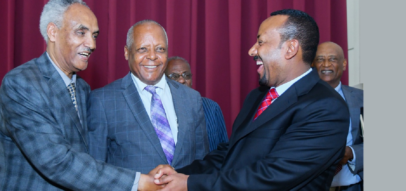 Prime Minister Abiy Ahmed with opposition leaders Beyene Petros, shaking hands, and Merera Gudina. Image credit: Ethiopia Insight