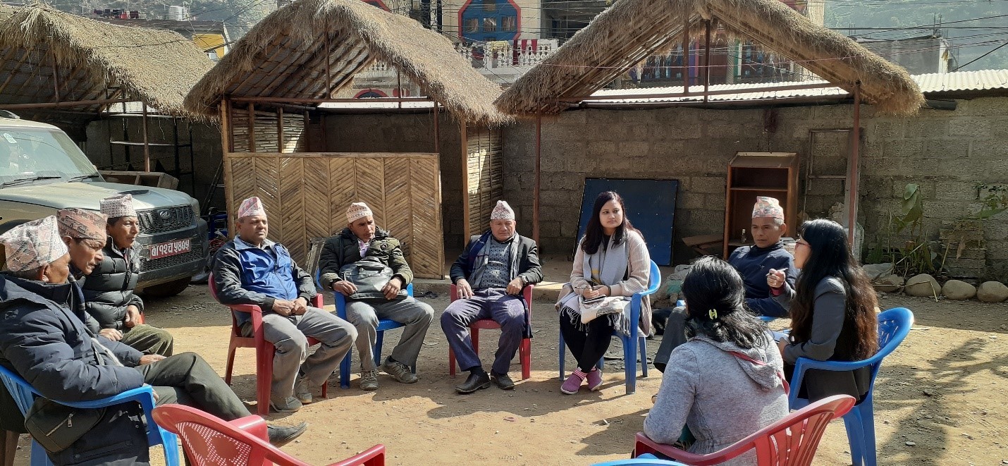  Local government mentors  from Nitishala Nepal talking to local representatives of Sunil Smriti Rural Municipality, Lumbini Province, Nepal.  image credit: International IDEA.