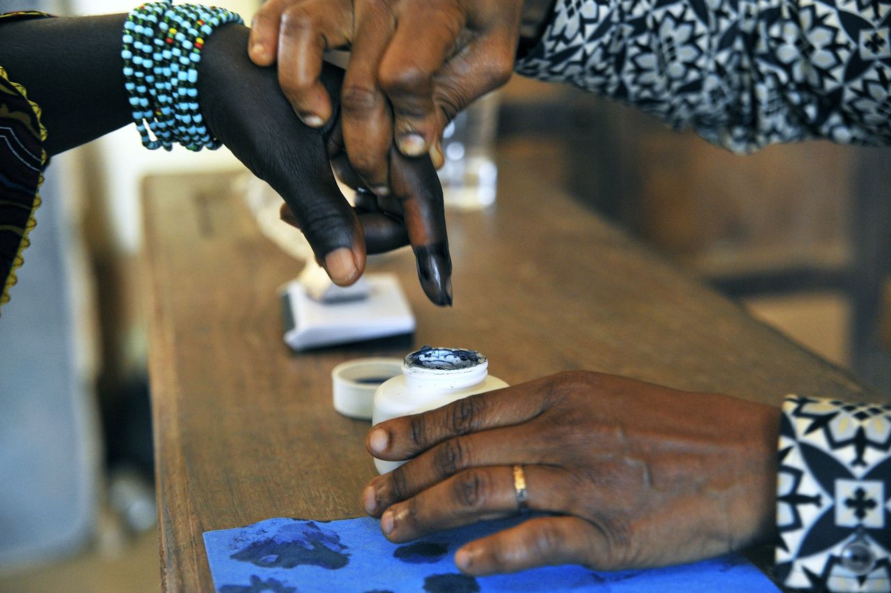 A woman has her finger dipped ink after voting in legislative by-elections in Grand Laho, Côte d'Ivoire Image: UN/Hien Macline