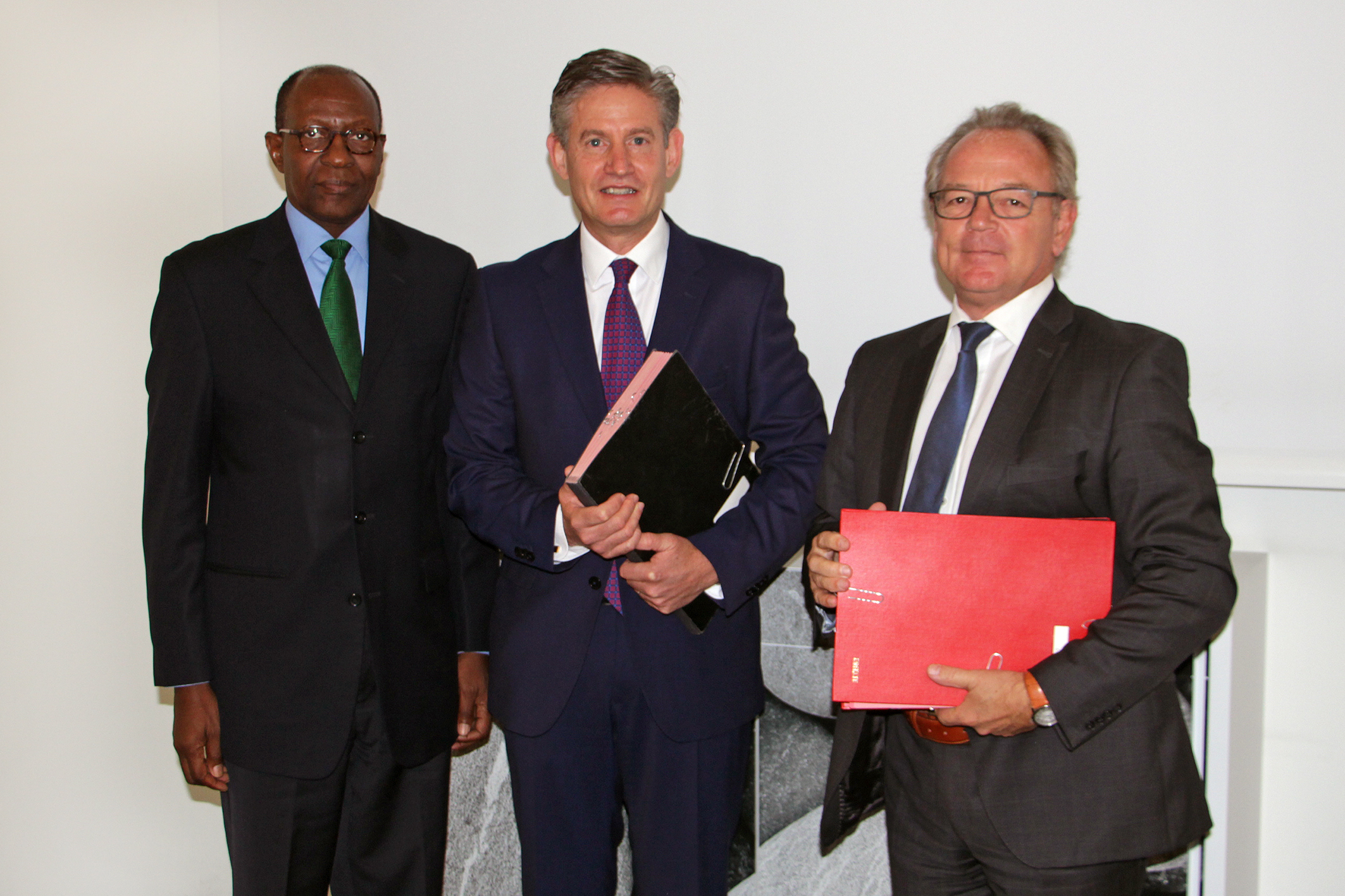 From left: H.E. Dr. Kaire Munionganda Mbuende, Ambassador of the Republic of Namibia to the Kingdoms of Belgium and the Netherlands, the Grand Duchy of Luxembourg, and Mission to the European Union; Andrew Bradley, Director of the Office of International IDEA to the European Union; Carl Michiels, Chairman of the Management Committee of the BTC at a signing ceremony between the BTC and International IDEA on 4 OCtober 2017