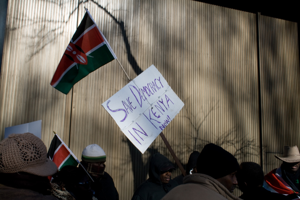 Protest sign reading "Save democracy in Kenya" 