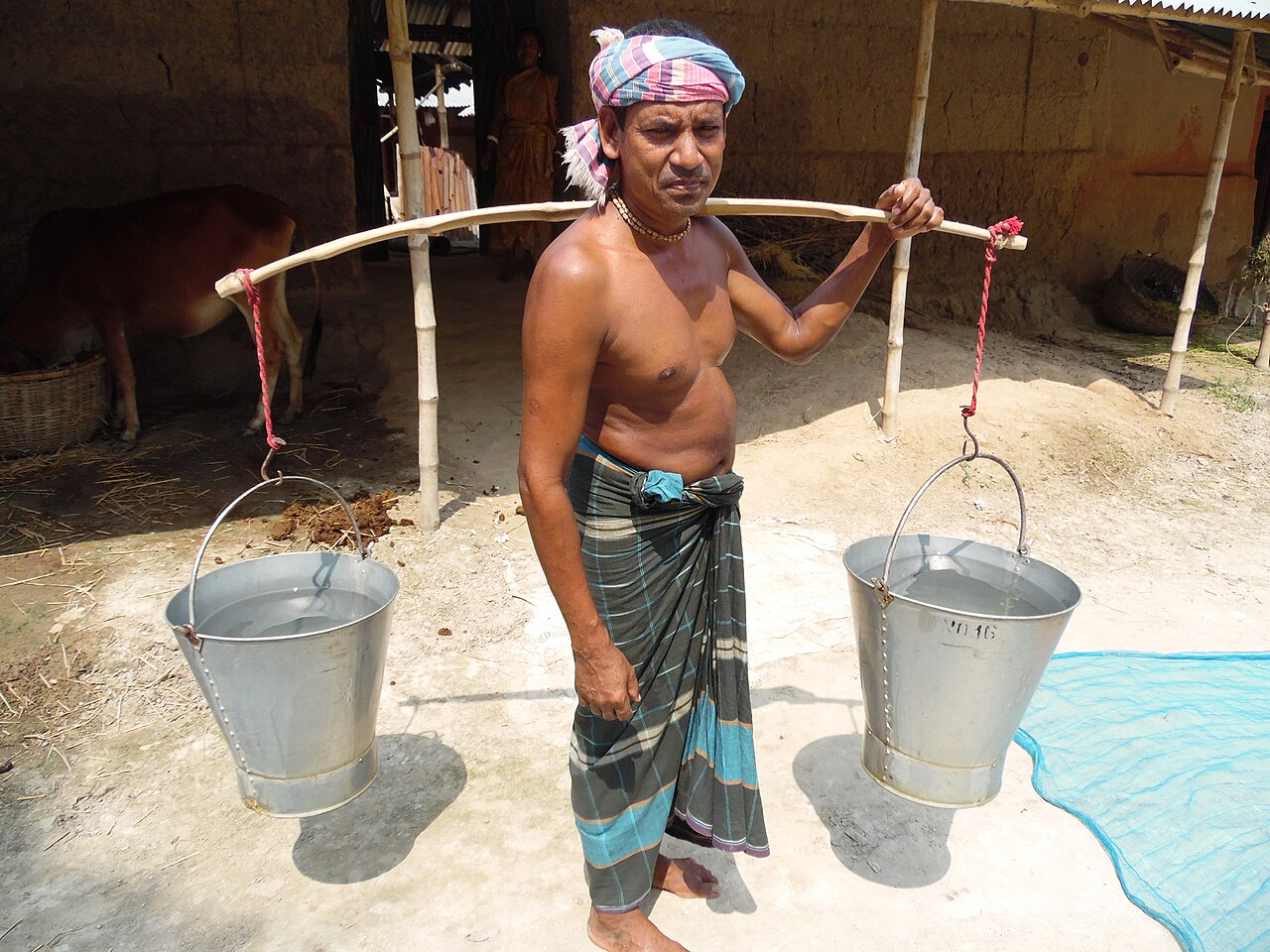Man carrying water buckets