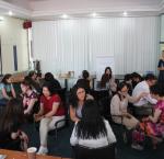 Reaching across the aisle: Women from opposing political parties sit together to discuss common challenges and ways to improve inclusiveness of political process in Mongolia in June 2018. Photo: BRIDGE workshop.