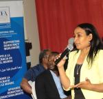 photo of a woman speaking in a meeting