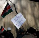Protest sign reading "Save democracy in Kenya" 