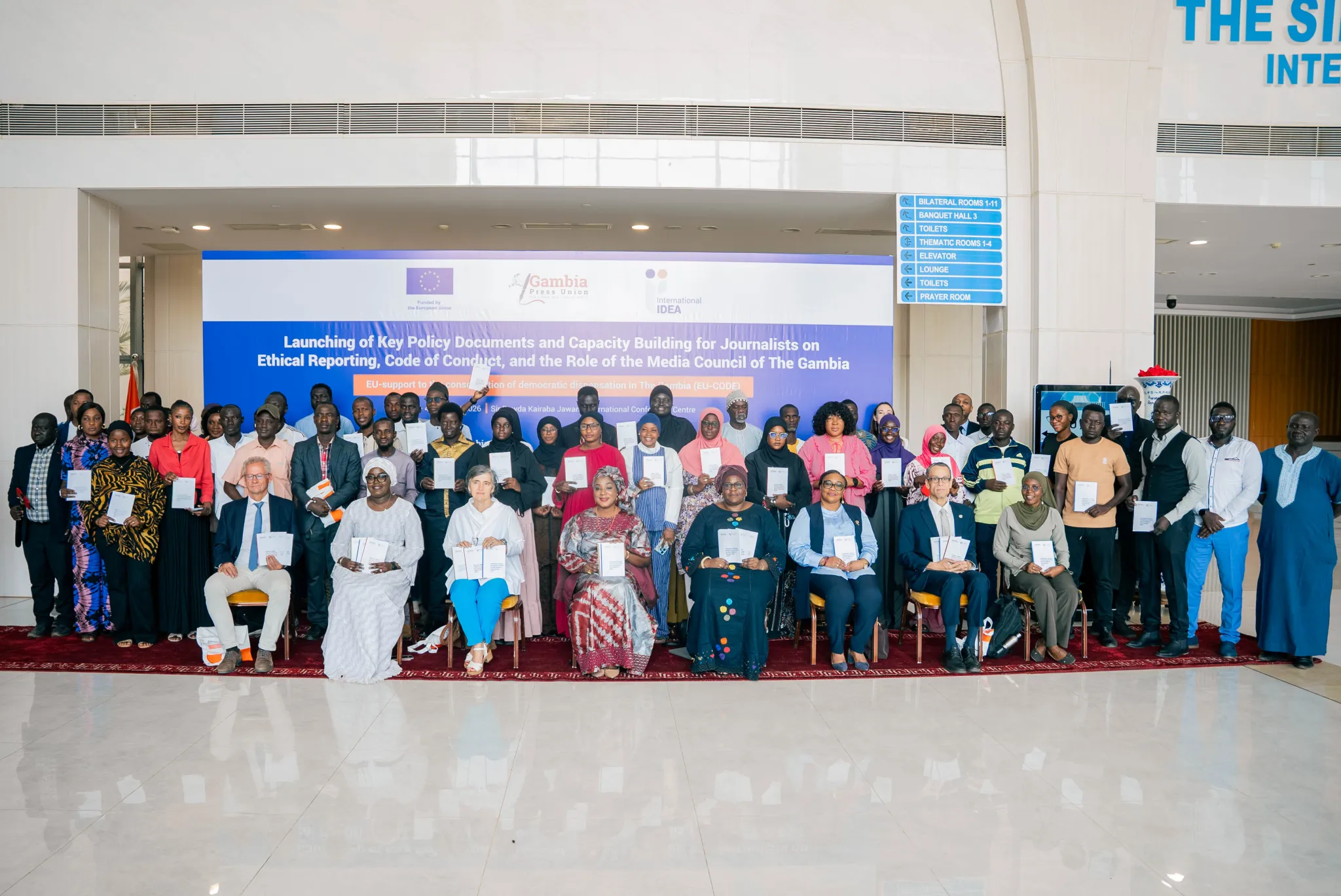 Participants posed for a group photo while displaying documents during the launch of key media policy documents on February 3, 2026, at the Sir Dawda Kairaba Jawara International Conference in Banjul, The Gambia.