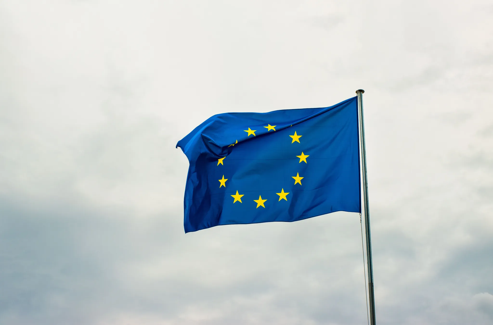 European Union flag waving. Photo credit: Dušan Cvetanović, Pexels.