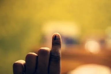 Finger pressed against glass