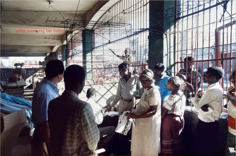 Voter receiving her ballot