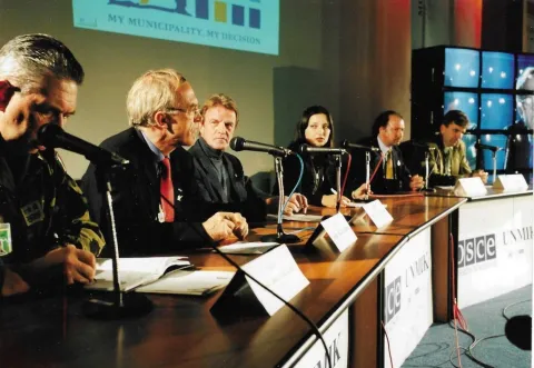OSCE Head of Mission Daan Everts (left), UN SRSG Dr. Bernard Kouchner (center), Jeff Fischer (right), and Others at a News Conference