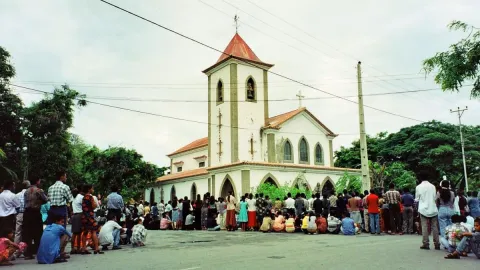 People gathered around a church in East Timor