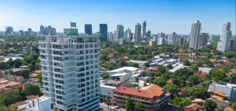 View of Asunción, looking northwest from the northern corner of the neighborhood of Herrera, Edificio Civis Alpha in the foreground. Image credit: Wikipedia.
