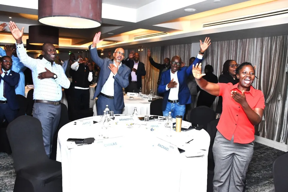 In a symbolic gesture, participants of the Dialogue for Male Engagement on Gender Equality and Transformative Social Norms clap their hands, with a forward motion embodying the act of debunking social norms, on 21 August 2025 in Nairobi, Kenya.