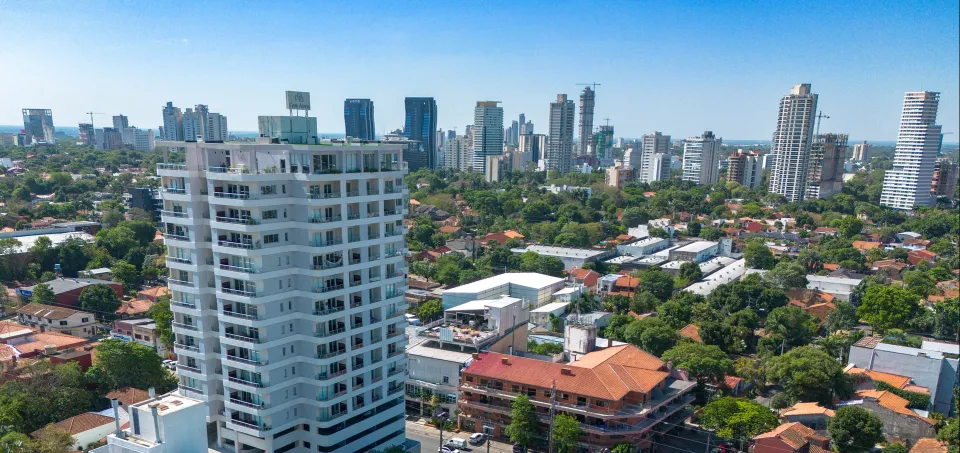 View of Asunción, looking northwest from the northern corner of the neighborhood of Herrera, Edificio Civis Alpha in the foreground. Image credit: Wikipedia.