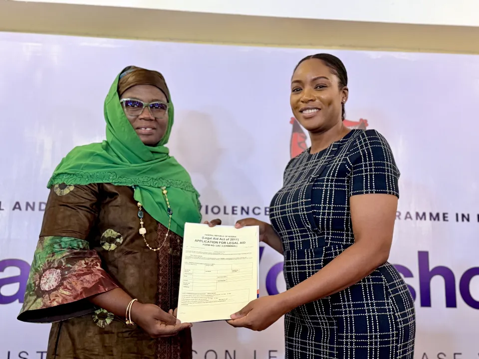 Melissa Omene, GBV Policy and Strategy Development Specialist with the ESGBV Programme, presents the SGBV Identification Guidelines and Checklists for Legal Aid Case Work to Dr. Mufuliat Fijabi, Senior Programme Manager of the ESGBV Programme.