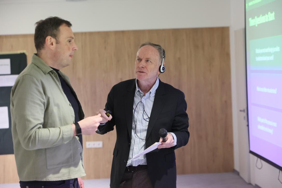 alistair-scrutton-discussing-presentation-with-participants-during-communications-workshop